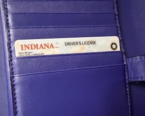 Indiana driver's license with the REAL ID star in a blue wallet